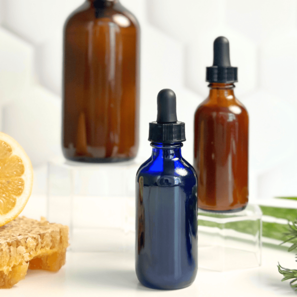 Amber glass dropper bottles for skincare formulations and essential oils, natural health products, and organic cosmetic ingredients, showcasing eco-friendly packaging solutions.